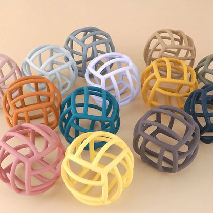 Colorful silicone teether ball for soothing baby gums, non-toxic and easy to grasp for infants.