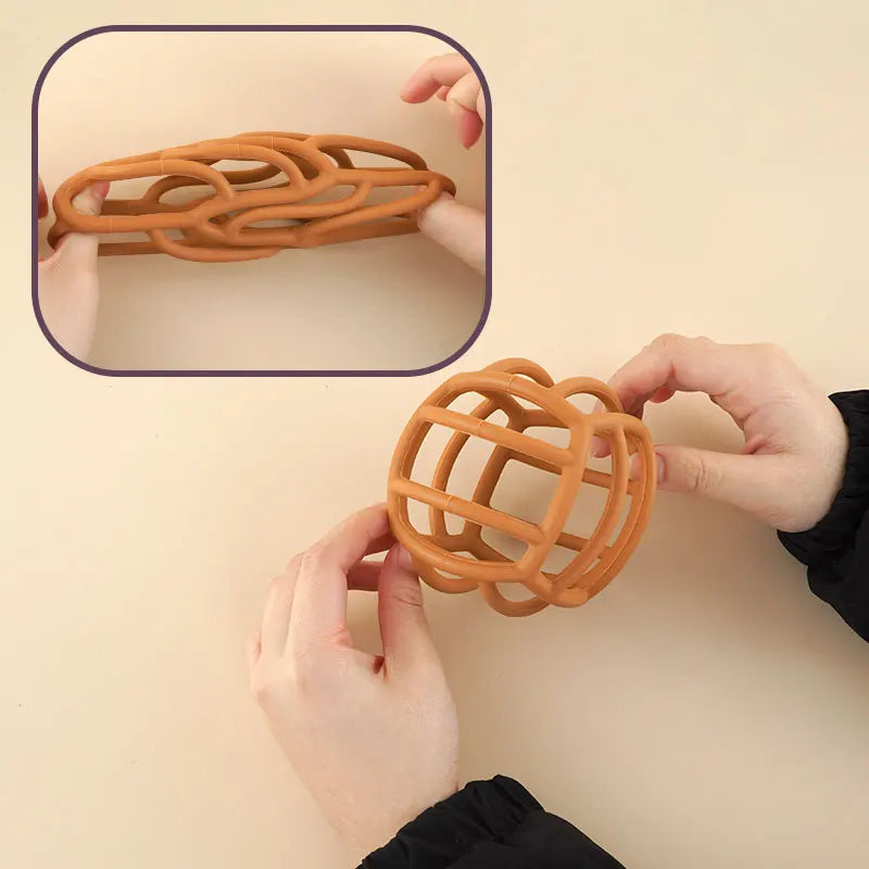 Textured silicone teether ball, ideal baby toy for teething relief and sensory exploration.
