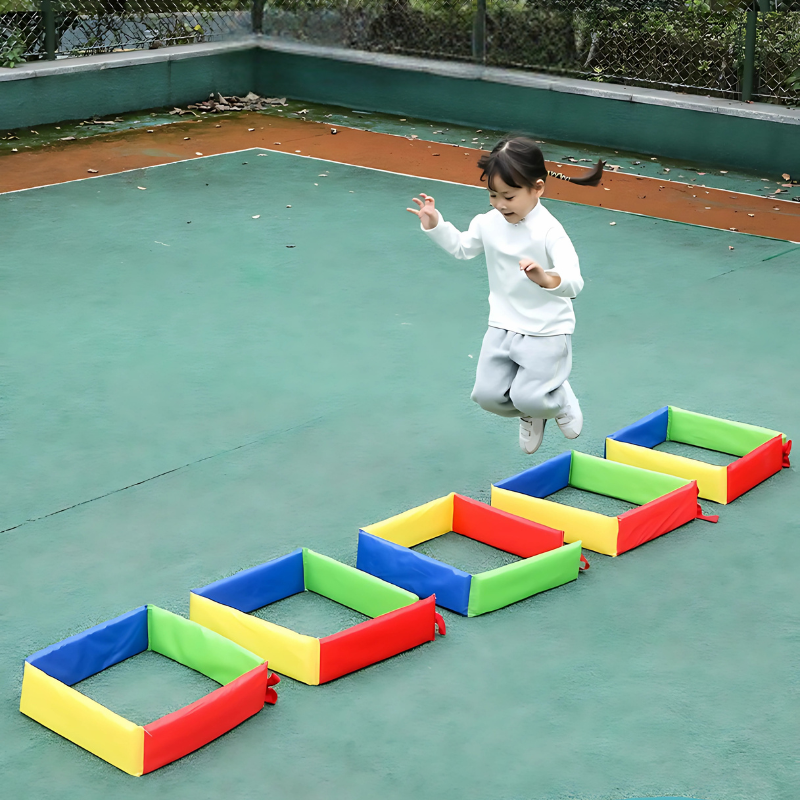 Colorful soft foam stepping squares arranged as an obstacle course for kids' active indoor play.