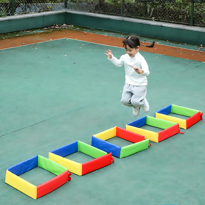 Colorful soft foam stepping squares arranged as an obstacle course for kids' active indoor play.