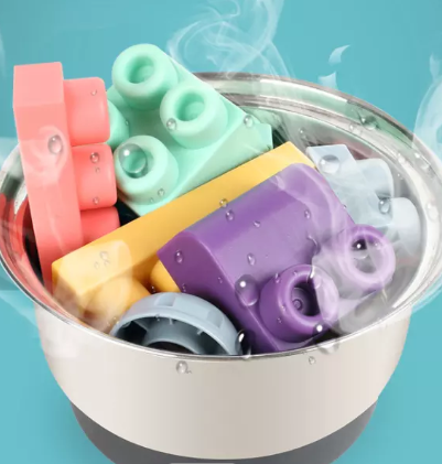 Silicone baby building blocks in various shapes and colors, promoting creativity and fine motor skills