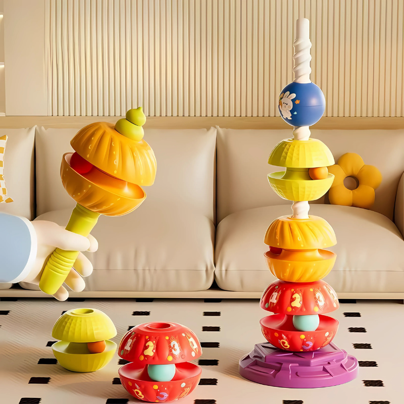 Colorful toddler spinning stacking toy with rings, enhancing motor skills and hand-eye coordination for early learning fun