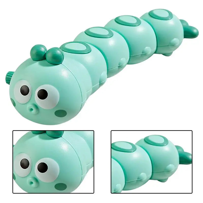 Smiling child playing with a vibrant wind-up crawling caterpillar toy, promoting early motor skills.