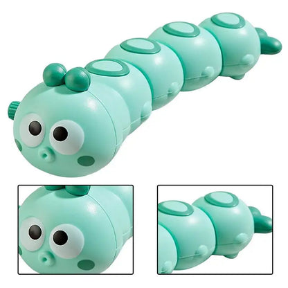 Smiling child playing with a vibrant wind-up crawling caterpillar toy, promoting early motor skills.