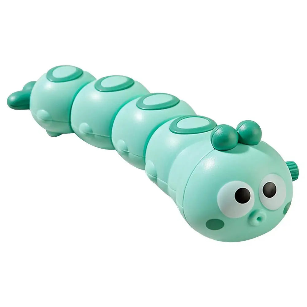 Toddler's hand winding up a colorful caterpillar toy, fostering fine motor skill development.