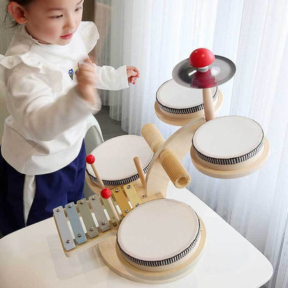 Toddler playing a vibrant wooden percussion set, fostering sensory play and music skills.