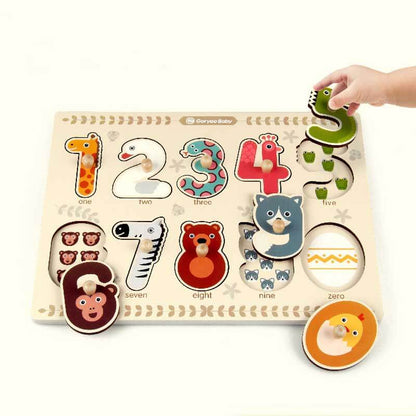 Toddler playing with a wooden animal number puzzle, learning counting and shapes