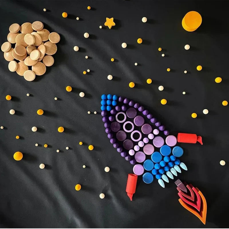 Close-up of a child's hands stacking a wooden rainbow toy, highlighting fine motor skills development.