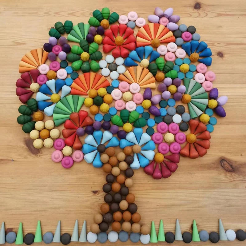 Rainbow toy for toddlers, featuring smooth wooden arches in various sizes on a play mat.