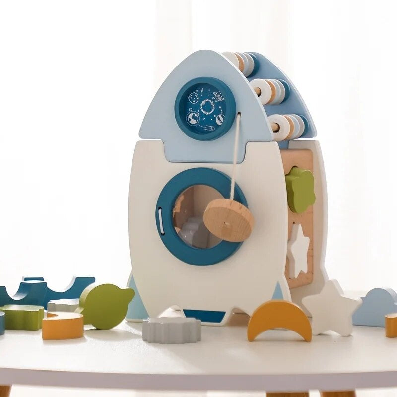 Colorful wooden rocket stacking blocks set for educational play, promoting fine motor skills.