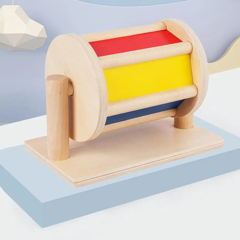 Colorful wooden spinning drum toy for toddlers, promotes sensory development & motor skills, baby activity toy
