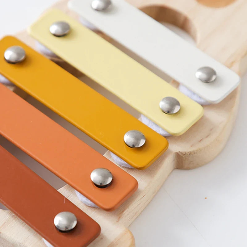 Hand-crafted wooden xylophone, a musical instrument for babies and toddlers, encouraging sensory learning.