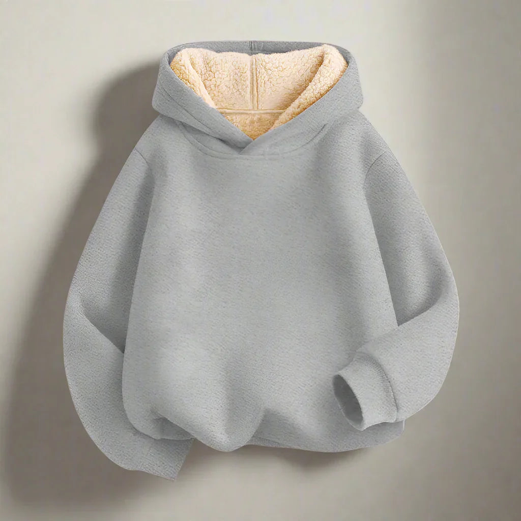 Soft fabric kids' hoodie, designed for comfort and a relaxed, loose fit.