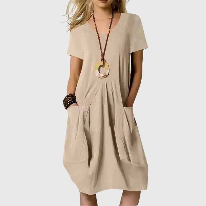 Versatile women's A-line casual dress, ideal for summer and spring, offering a comfortable loose fit with pockets.