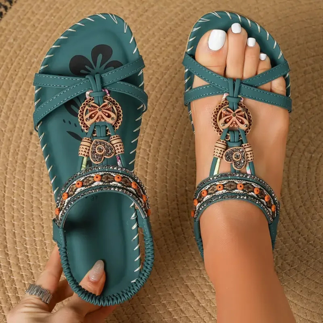 Comfortable women's flat T-strap sandals for everyday summer casual wear.