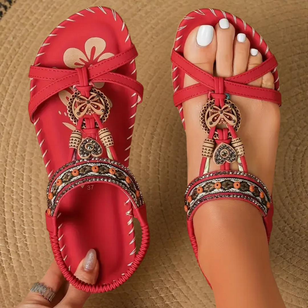 Women's stylish flat T-strap sandals, ideal for warm weather and casual everyday comfort.