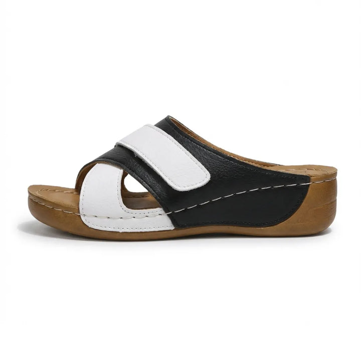 Comfortable women's orthopedic wedge sandals with adjustable straps and arch support.