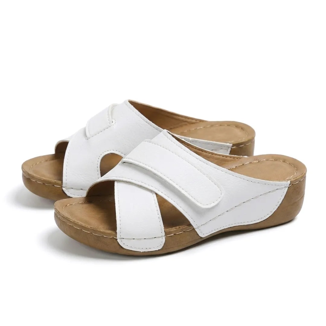 Women's orthopedic wedge sandals, designed to alleviate foot fatigue and discomfort.