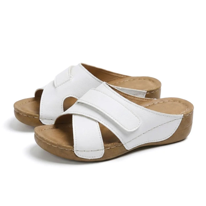 Women's orthopedic wedge sandals, designed to alleviate foot fatigue and discomfort.