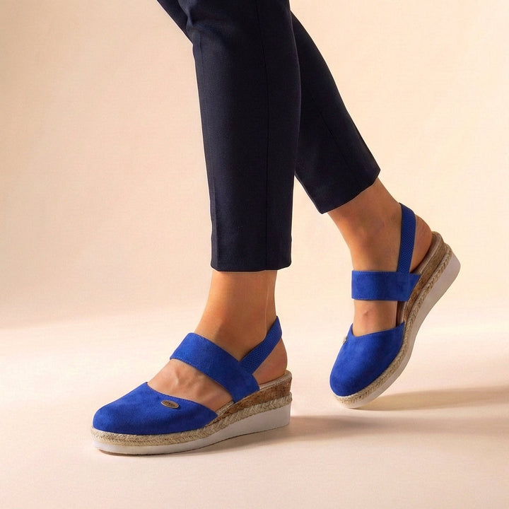 Close-up of comfortable women's espadrille platform sandals, showcasing summer style and design.