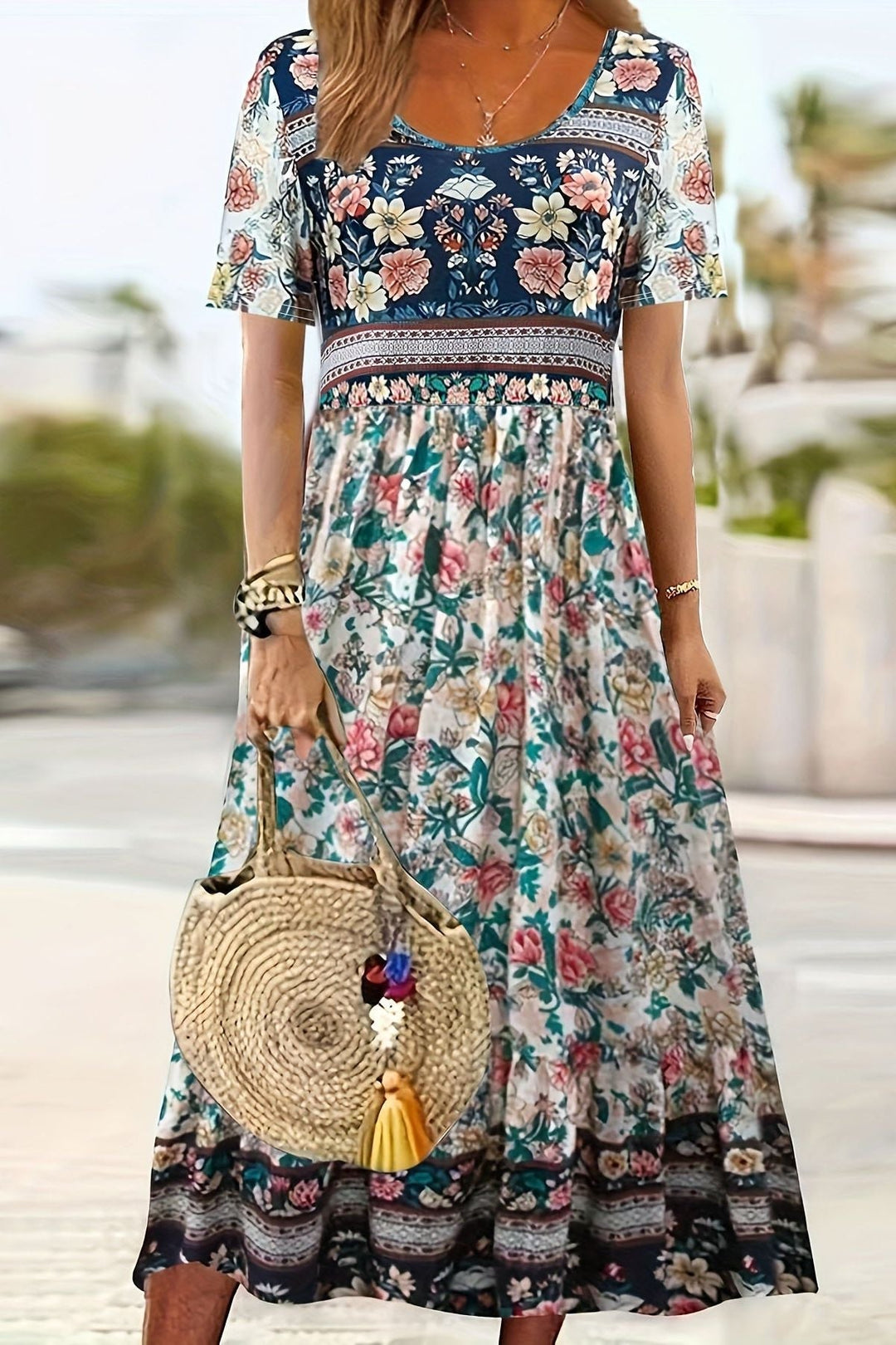Stylish women's spring/summer midi dress with an elegant print, knee-length for versatile casual wear.