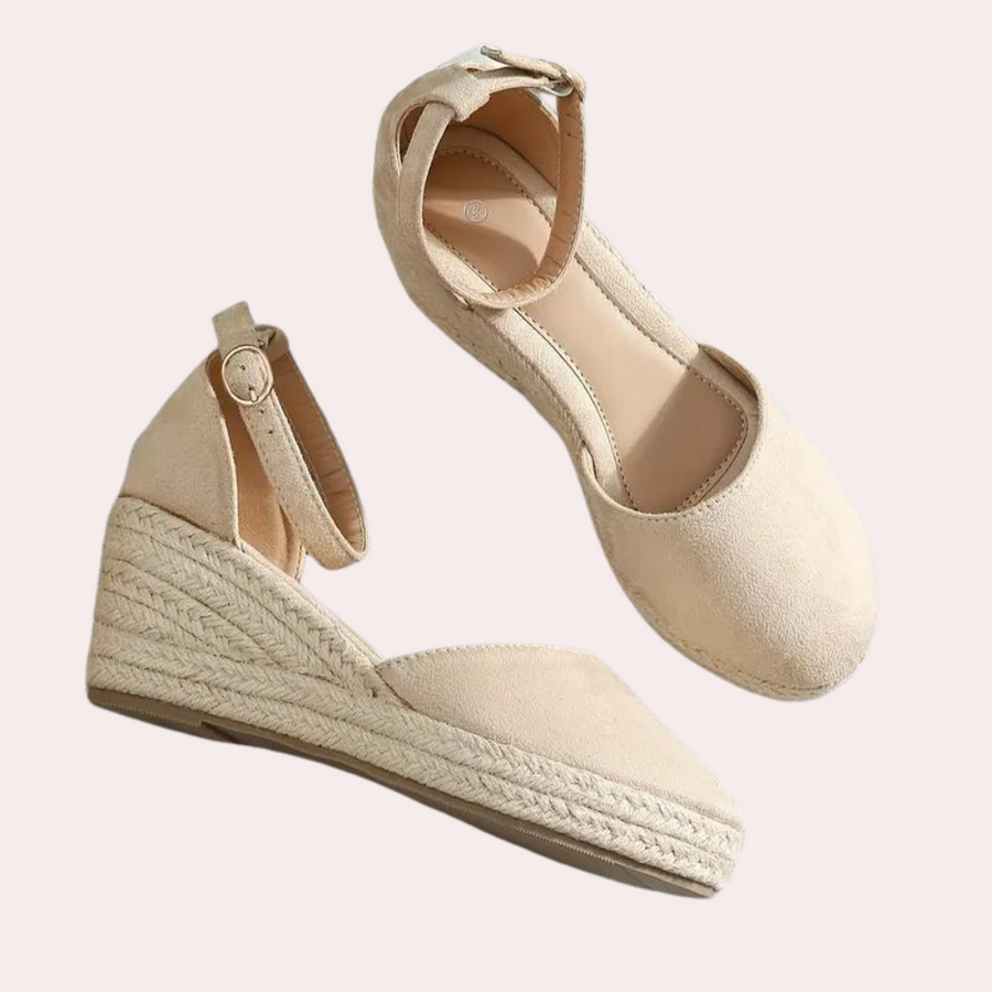 Elegant women's wedge sandals with a comfortable heel and adjustable strap, ideal for office or summer casual.