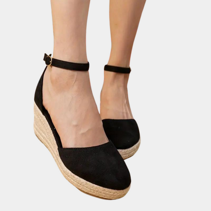 Versatile women's wedge sandals with adjustable strap, offering comfort and style for casual or elegant summer wear.