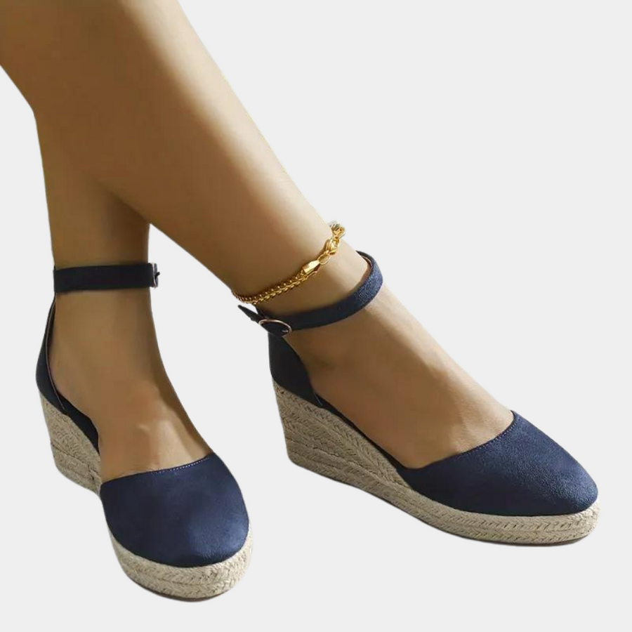 Stylish women's wedge sandals with an adjustable ankle strap and comfortable wedge heel, suitable for elegant office wear.