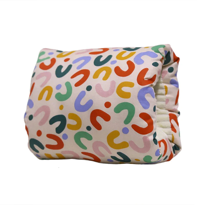 Nursing mother looking relaxed with the Comfy Cradle Arm Pillow providing excellent support.
