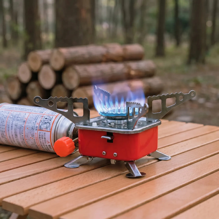 Compact folding camping stove for efficient outdoor cooking. Portable design ideal for backpacking and hiking adventures.