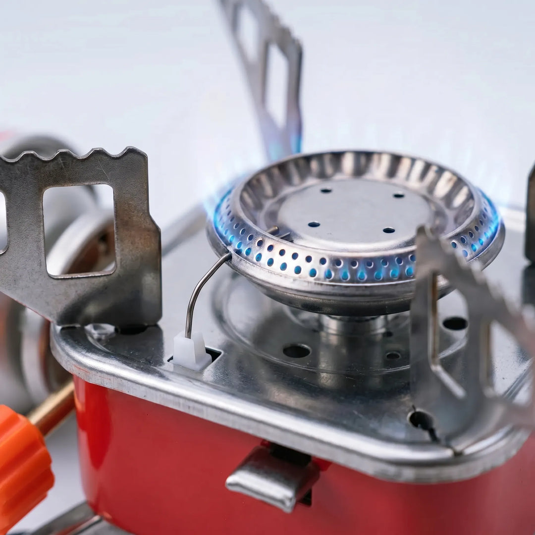 Compact and portable folding camping stove for outdoor adventures. Essential gear for efficient camp kitchen cooking.