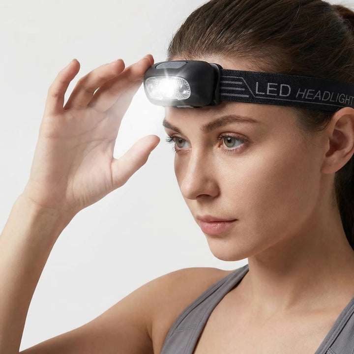 Rechargeable LED headlamp, ultra-bright & hands-free. Essential portable lighting for any outdoor activity.