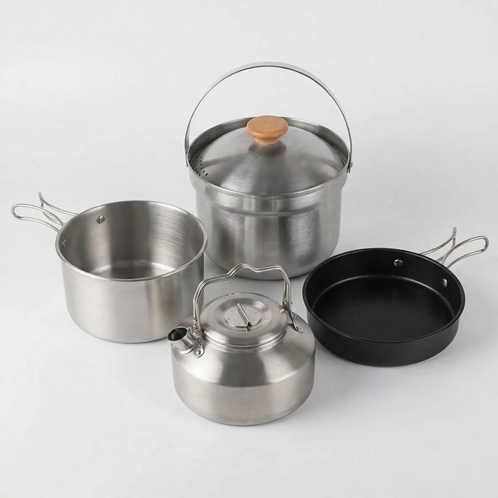 Portable camping cookware set with camp pot, frying pan, and kettle; essential hiking gear for outdoor kitchens.
