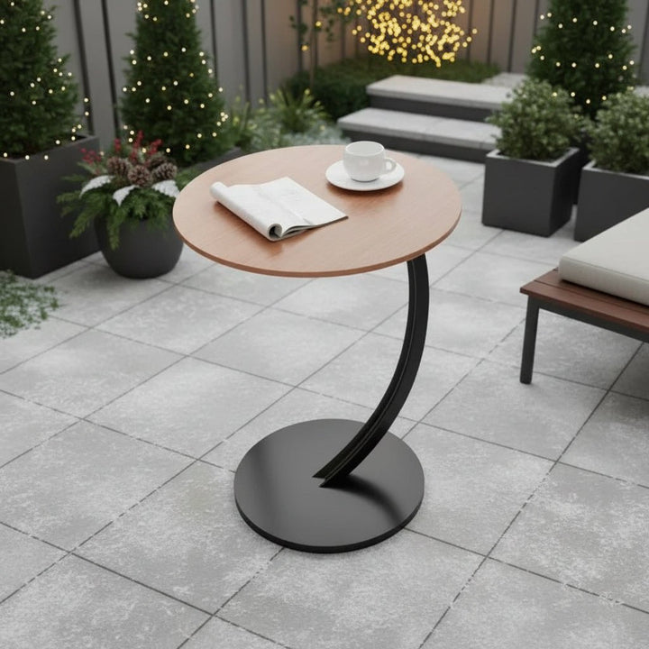 Compact round side table, modern design for small living rooms.