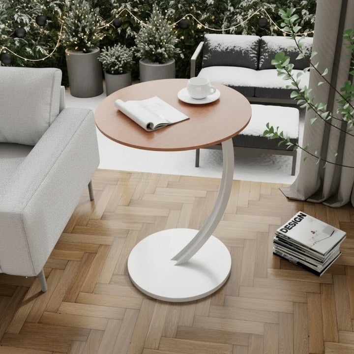 Modern round accent table, space-saving furniture for small areas.