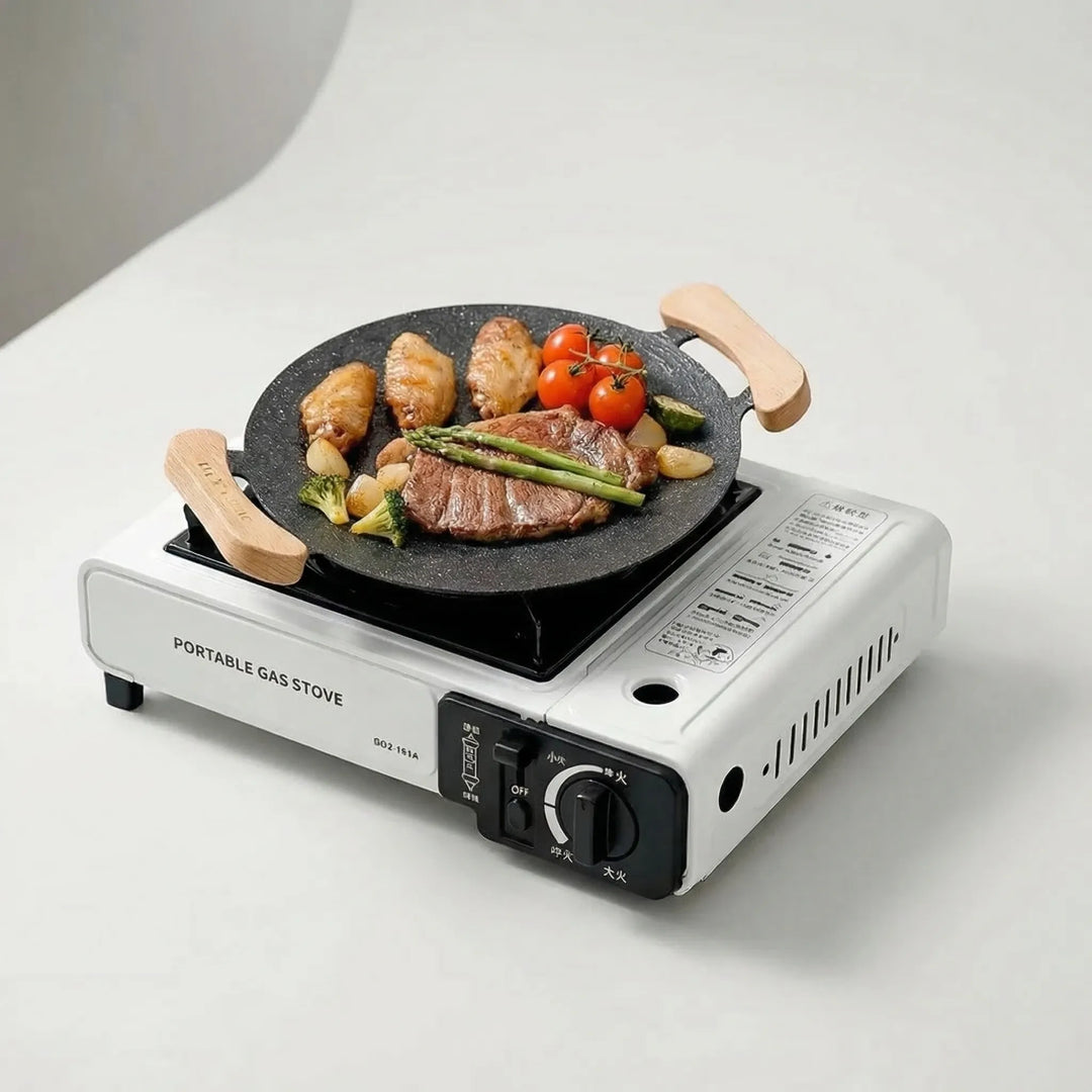 Butane-powered portable gas stove for outdoor cooking, perfect for camp kitchen and travel.