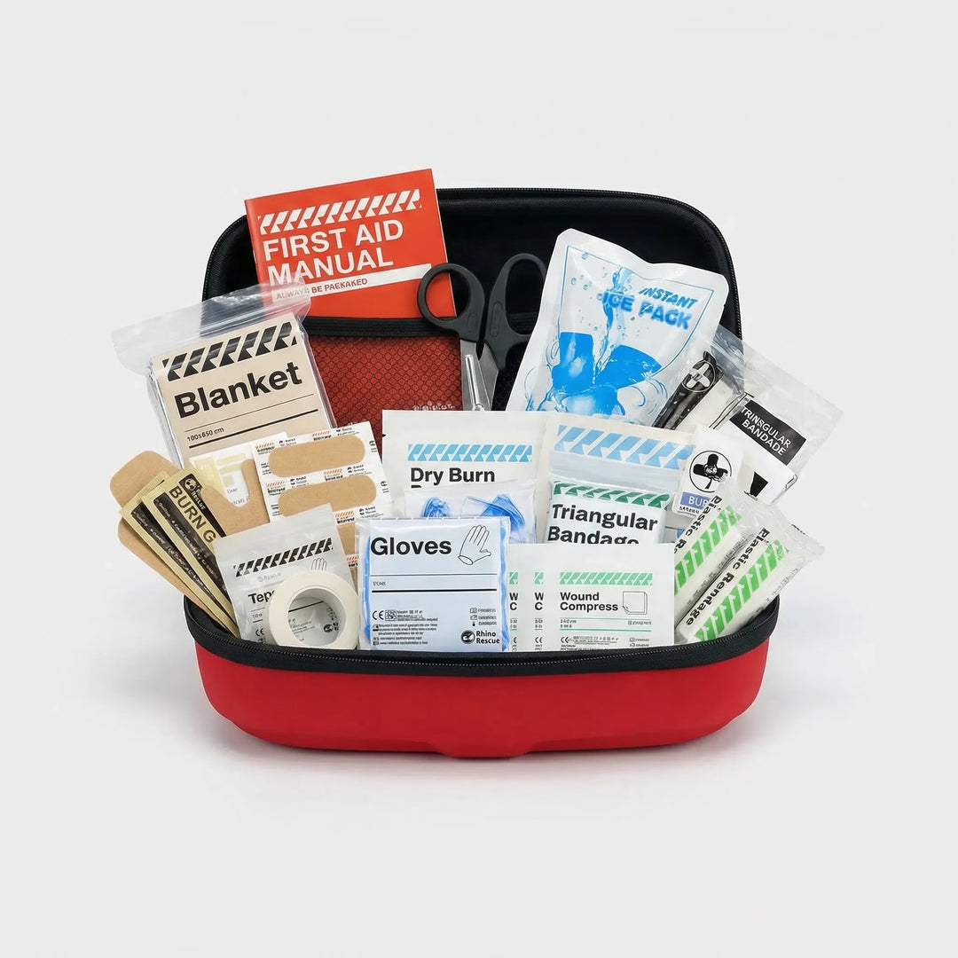 Hand holding a compact waterproof first aid kit, essential for hiking, camping, travel, and emergency medical safety.