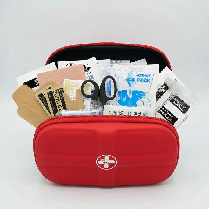 Closed, bright red, compact waterproof first aid kit for travel & outdoor emergencies. Hiking & camping essential.