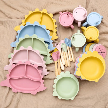 BPA-Free silicone feeding spoon and fork set designed for baby's small hands, promoting independence.