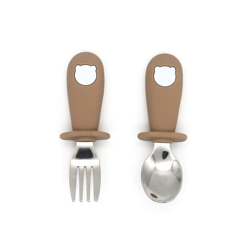 Divided silicone baby plate with strong suction base, paired with a matching silicone spoon & steel fork.