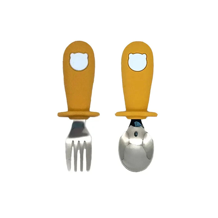 Modern baby tableware set in neutral grey, includes silicone plate, bowl, spoon, and stainless steel fork.