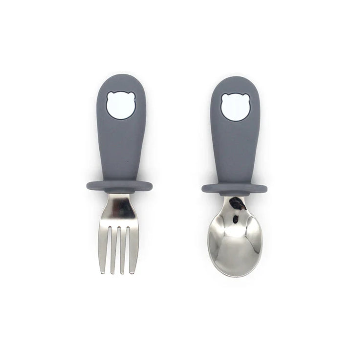 Healthy eating toddler cutlery & tableware: silicone plate, bowl, spoon, and stainless steel fork.