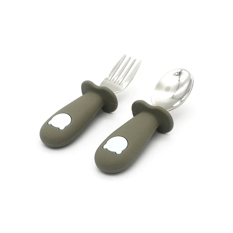 Pink silicone self-feeding utensil set for infants. Includes easy-grip silicone spoon & stainless steel fork.