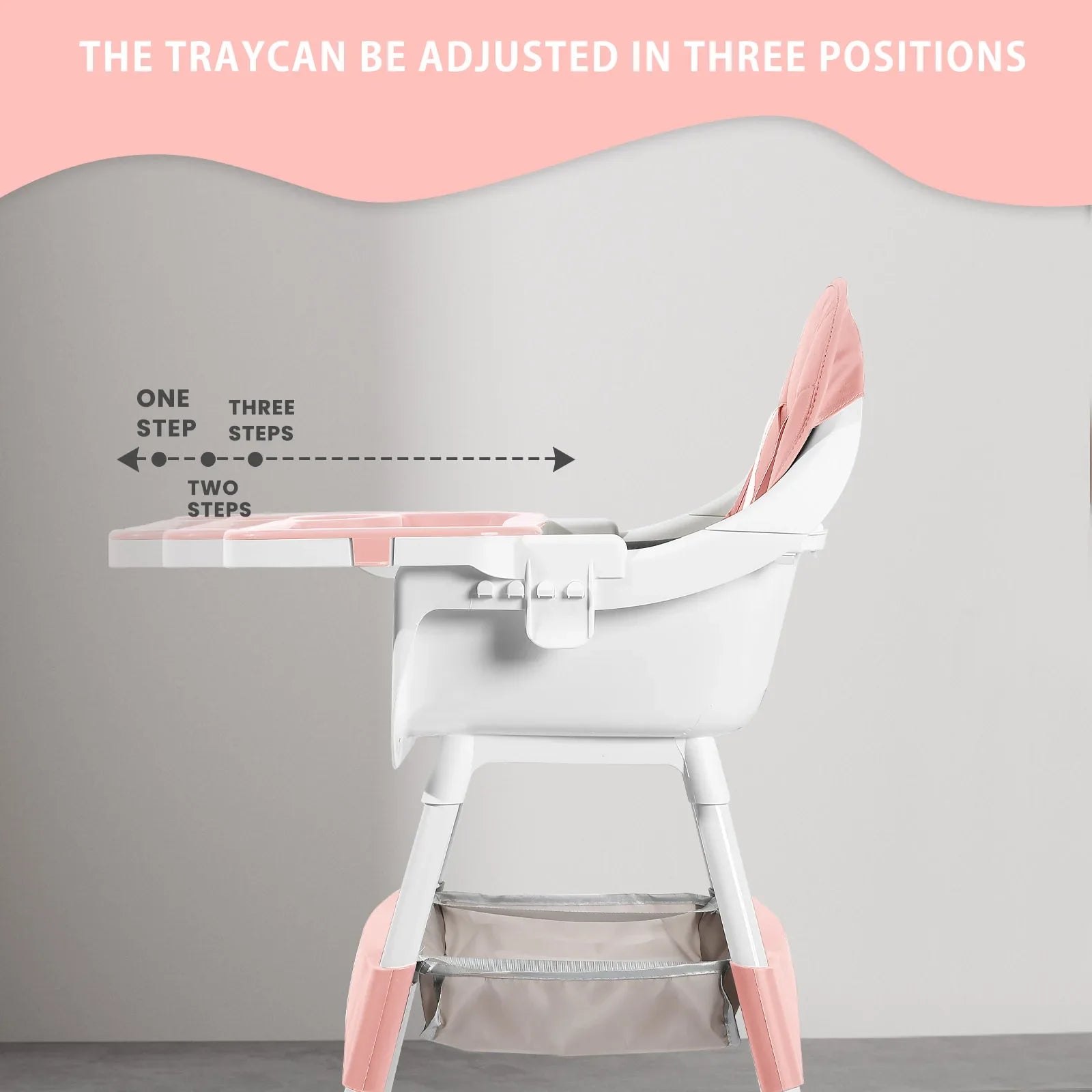 Baby feeding in a modern convertible high chair, featuring a practical double tray design