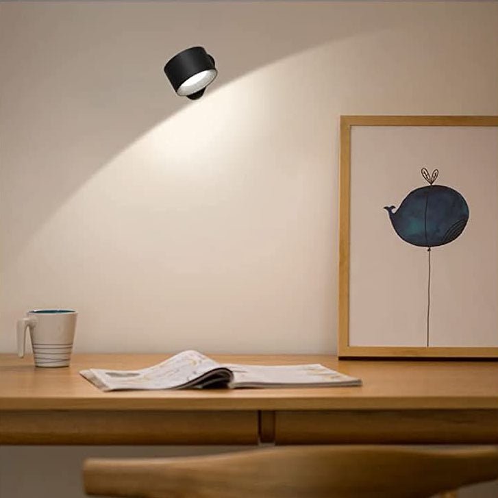 Modern cordless wall lamp with rotatable LED, perfect for stylish, flexible lighting in bedrooms or offices.
