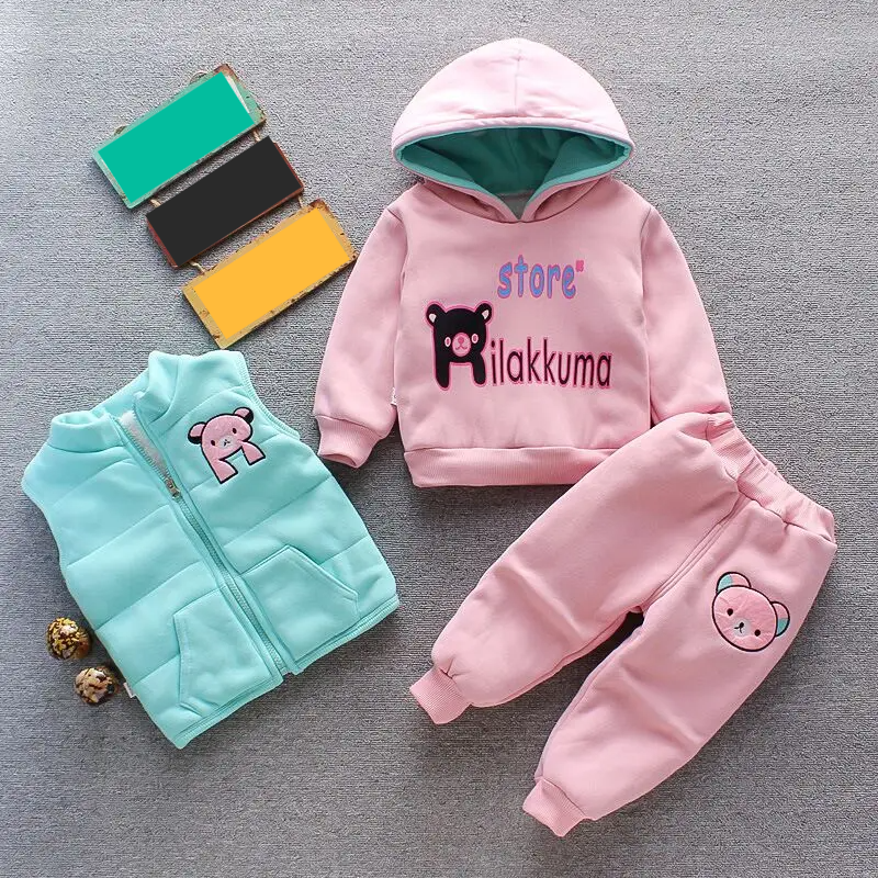 Kids clothing: Soft bear fleece jacket, practical vest, and stretchy pants for chilly days.