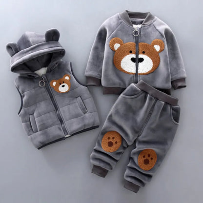 Toddler outfit featuring a hooded fleece bear jacket, layering vest, and easy-fit pants.