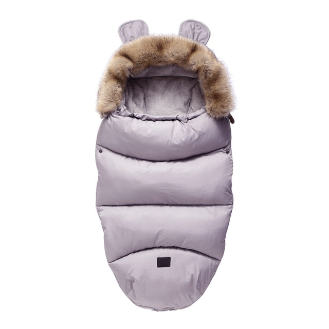 Baby travel essential: warm stroller footmuff, windproof sleeping bag for infants, universal accessory.