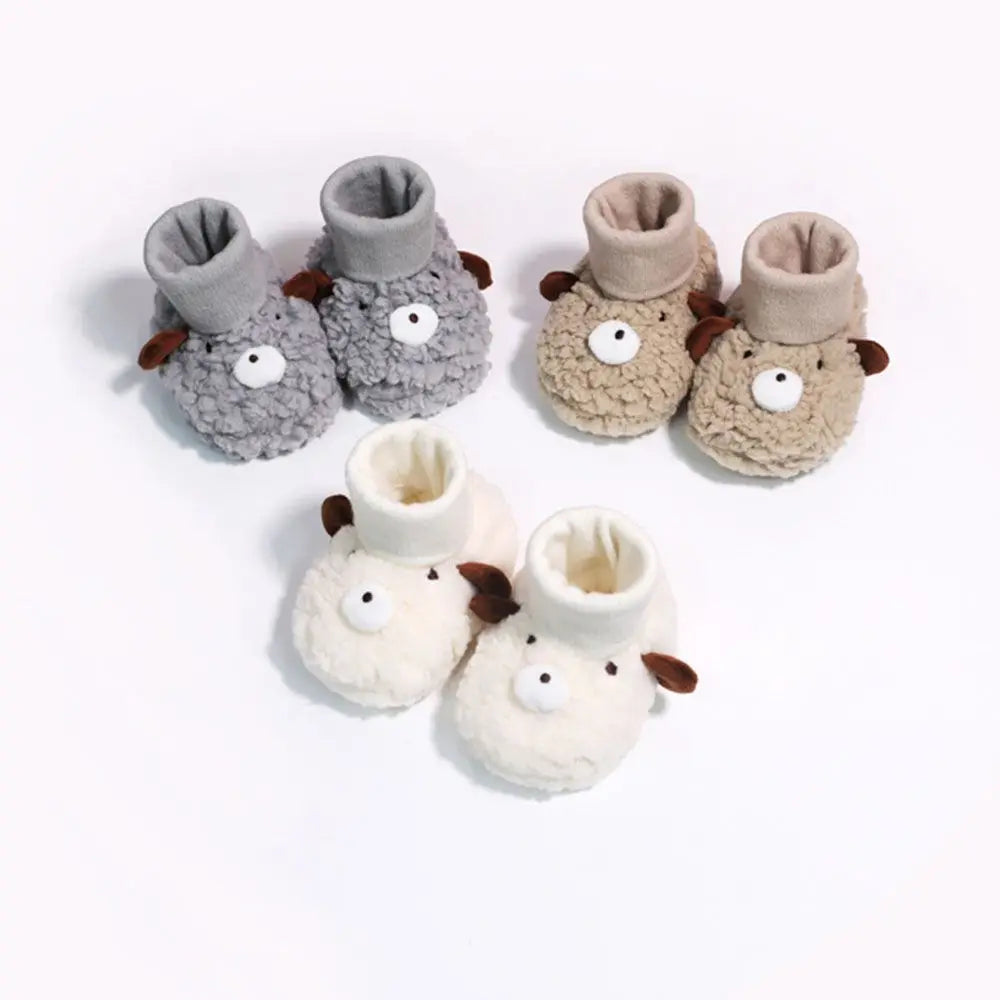 Cozy brown baby bear fleece slippers for infants, soft sole booties, perfect for winter babywear.