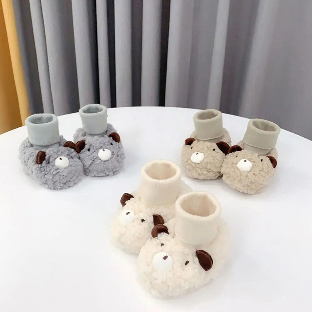 Infant baby bear slippers in warm fleece, soft sole booties for ultimate comfort and coziness.